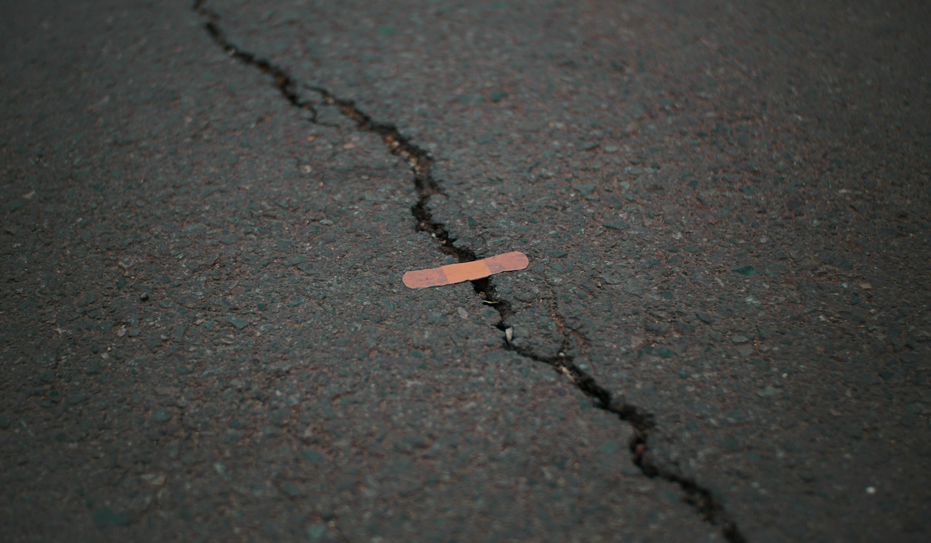A sticking plaster over a crack in the road.